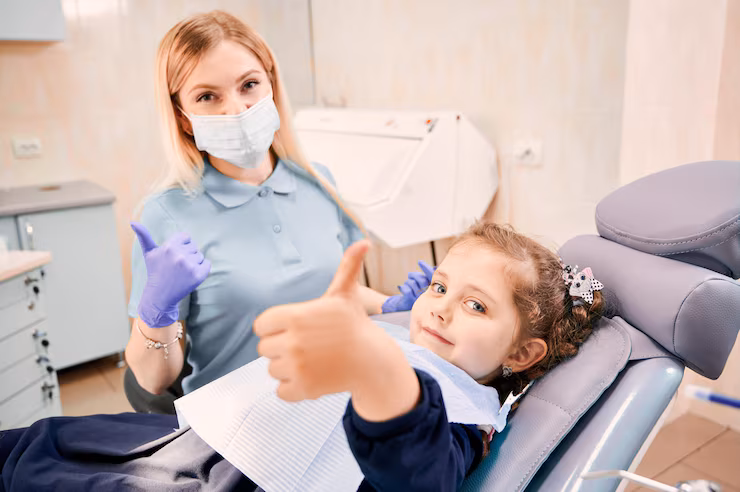 female-dentist-cute-little-girl-giving-thumbs-up_651396-2220 Nitrous Oxide in Batesville, IN