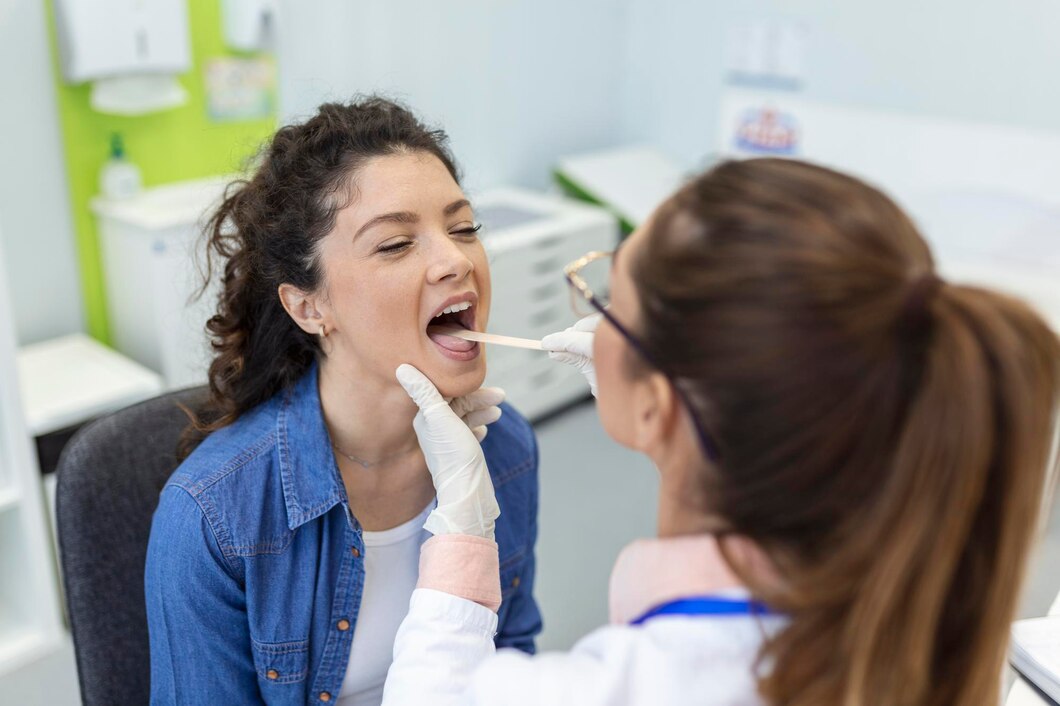 female-patient-opening-her-mouth-doctor-look-her-throat-otolaryngologist-examines-sore-throat-patient_657921-181 General Anesthesia Dentistry in Batesville, IN